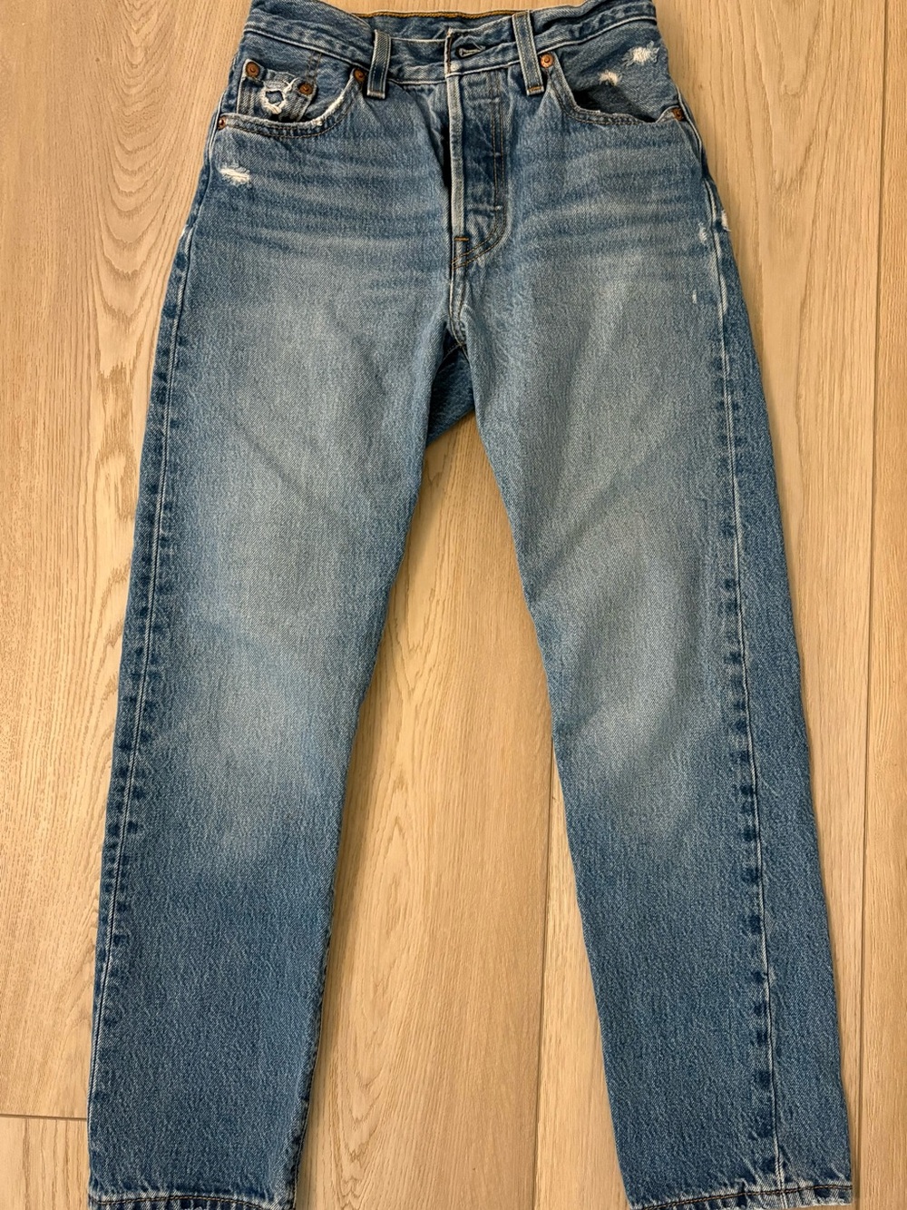 Levi's Straight Leg Jeans in Light Blue Distressed Wash